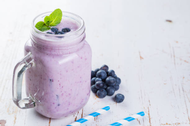 istock Blueberry jogurt smoothie in glass jar 648803560
