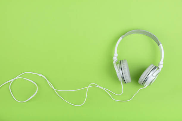 istock Headphones on green background 648804592