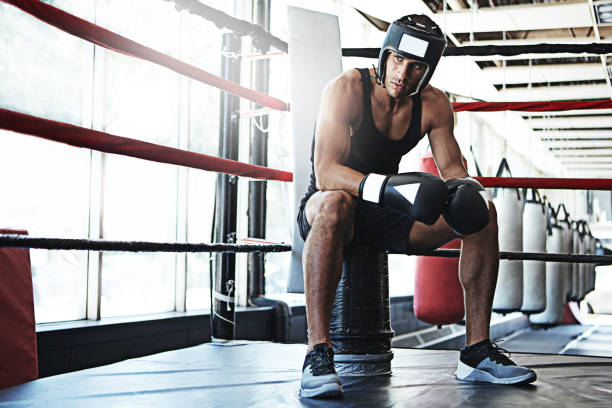 Shot of a young man training in a boxing ring