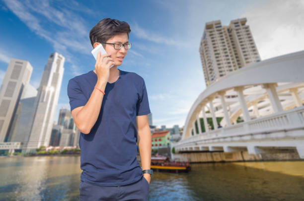 istock Asian business man using laptop and digital tablet in Singapore 648809158