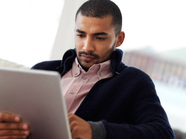 istock Catching up on his online reads 648812894