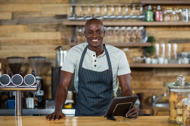 istock Portrait of waiter standing at counter 648813112