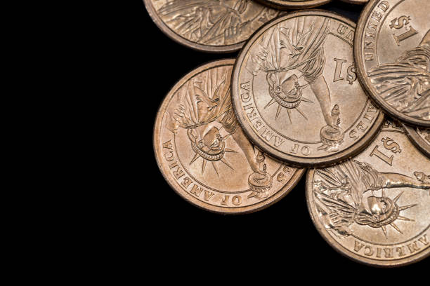 istock us coin dollar isolated on black background. 648819010