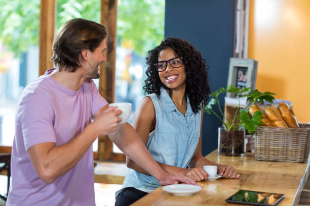 istock Couple interacting with each other at counter 648821294