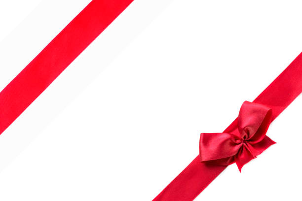 istock Red ribbon with bow isolated on white background 648821492