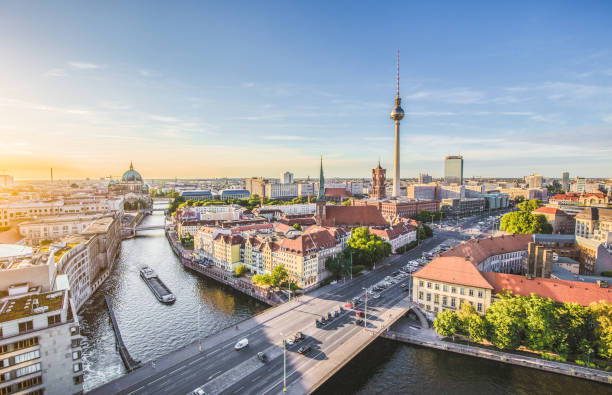Berlin skyline with Spree river at sunset, Germany Aerial view of Berlin skyline with famous TV tower and Spree river in beautiful evening light at sunset with retro vintage Instagram style grunge pastel toned filter effect, Germany spree river photos stock pictures, royalty-free photos & images