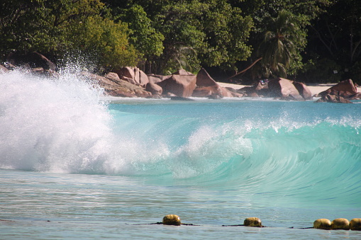 People enjoy the beach Anse Lazio on Praslin Island, Seychelles.\n