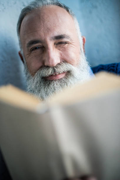 istock Senior bearded man smiling at camera 648834156