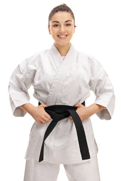 joven cita con un kimono con cinturón negro - martial arts women tae kwon do black belt fotografías e imágenes de stock