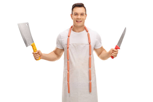 istock Young butcher with a cleaver and a knife 648835350