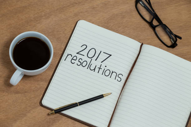 istock Close-up of coffee cup with diary and belongings 648835358