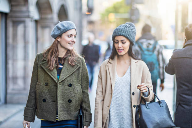 istock Beautiful female friends walking on sidewalk 648840352