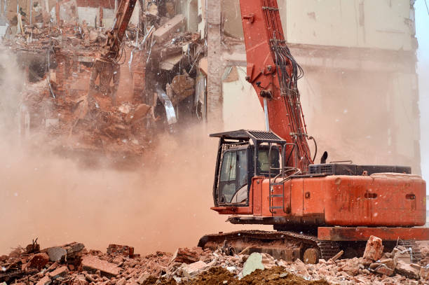 istock House demolition with big hydraulic scissors 648844536