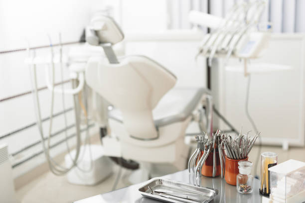 istock Medical room with odontological device and instruments 648845332