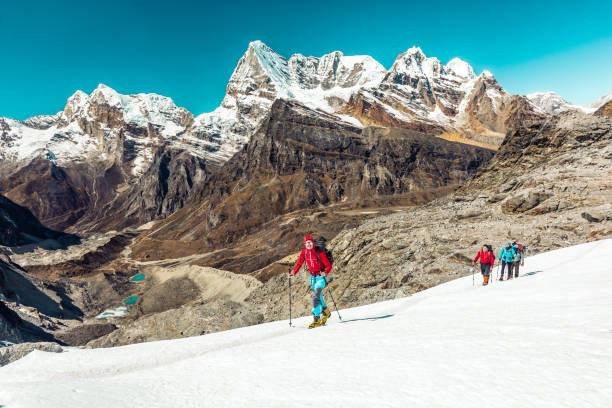 istock Mountain Climbers ascending Snow Slope on the Way to Summit 648850274