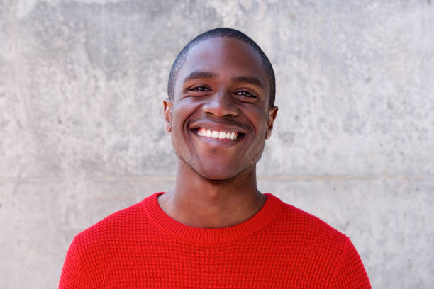 istock smiling african american man in red sweater 648856206