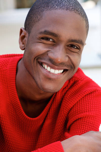 istock smiling african american guy in red sweater 648856318