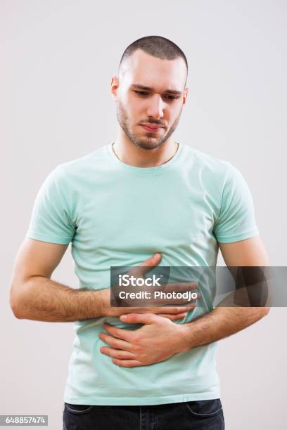 Man With Diarrhea Stock Photo - Download Image Now - Abdomen, Gripping, Men