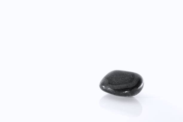 istock Black and White Natural Smoothe Rock Isolated 648863836