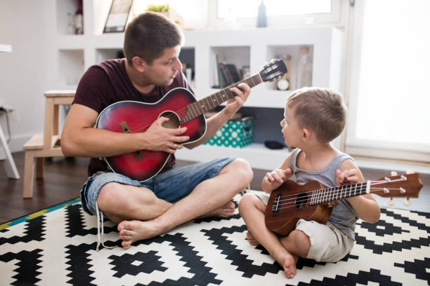 istock Daddy and his son rocking together 648864036