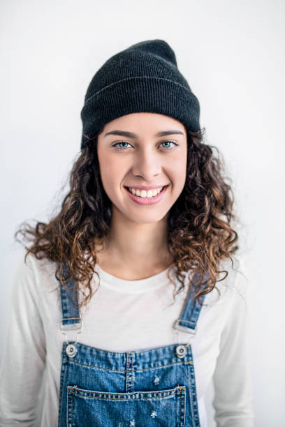istock Smiling young lesbian standing against white wall 648867798