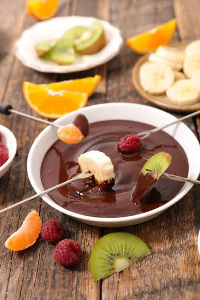 istock chocolate fondue with fruits 648869050