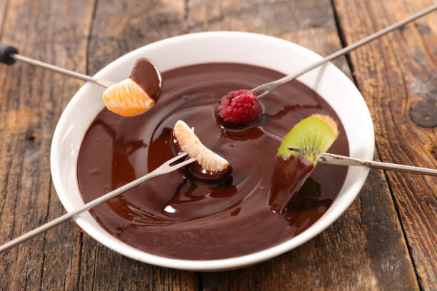 istock chocolate fondue with fruits 648869076