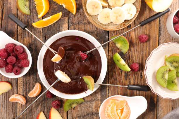 istock chocolate fondue with fruits 648869186
