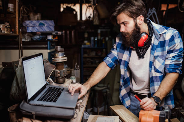 istock Young Furniture Designer working at his workshop 648877862