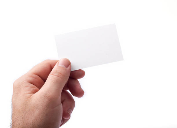 istock Business cards isolated on white holding in hands 648905274