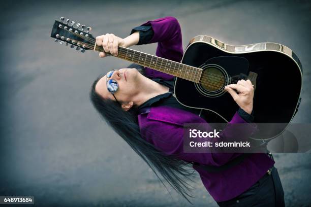 Man Playing 12 String Acoustic Guitar Stock Photo - Download Image Now - Men, Adult, Adults Only