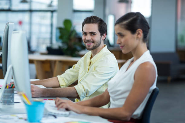 istock Portrait of male graphic designer working on personal computer 648915996