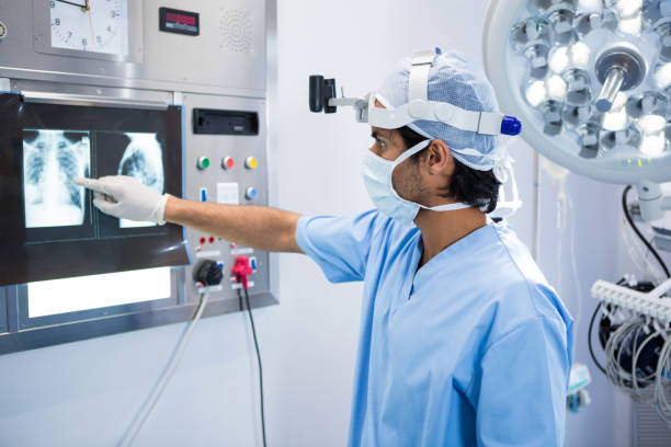 istock Male surgeon reading x-ray 648916852