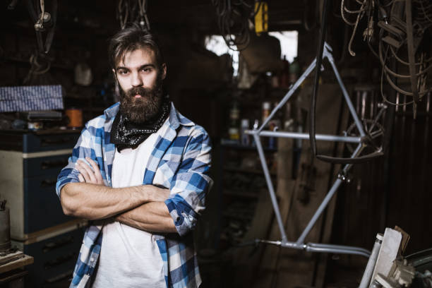 istock Portrait of young handsome hipster carpenter in his workshop 648923214