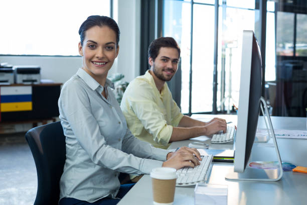 istock Portrait of graphic designers working on personal computer 648926572