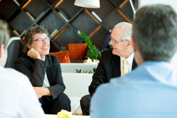 istock Business Partners Having Rest and Talking in Lounge 648927442