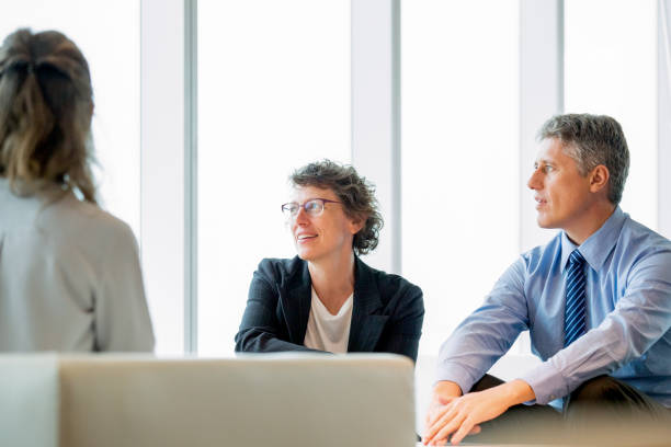 istock Three Coworkers Having Rest in Lounge 648927732