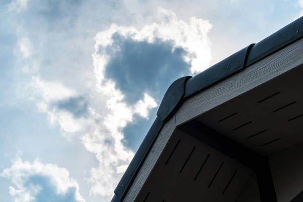 istock Gabled roof under a cloudy sky 648927830