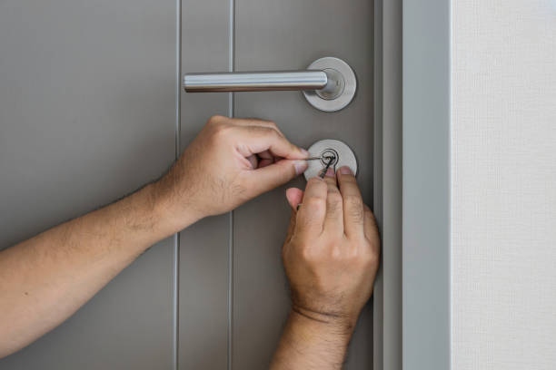 istock locksmith try to open the door by screwdriver 648929922