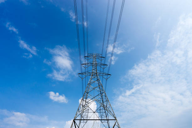 istock High voltage power towers blue sky background. 648930128
