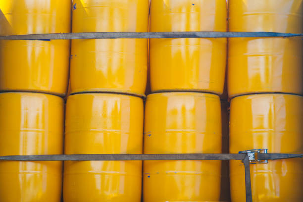 Yellow metal barrels strapped with straps
