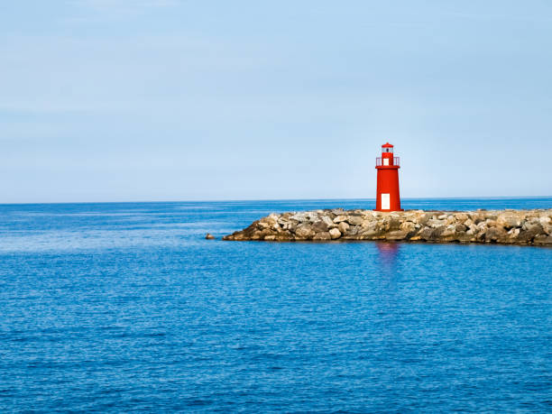 istock Red lighthouse at the port of entry reporting 648934522