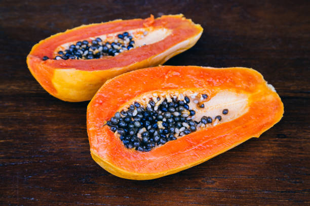 istock Papaya fruit on wooden background. 648938320