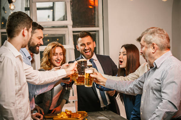 istock Group of friends enjoying evening drinks with beer 648938322