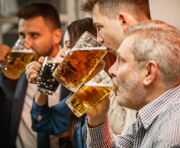 istock Group of friends enjoying evening drinks with beer 648938724