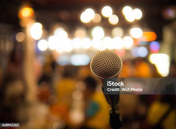 Single Microphone With Blurred Background Stock Photo - Download Image Now - Karaoke, Bar - Drink Establishment, Concert