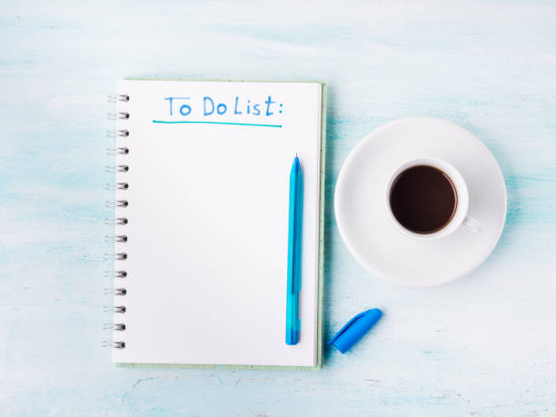 istock To do list page flat lay and cup of coffee background 648943154