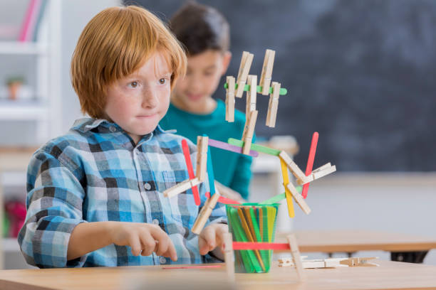 Children Using Building Sticks 20+ Popsicle Stick Building Stock Photos, Pictures & Royalty-Free ...