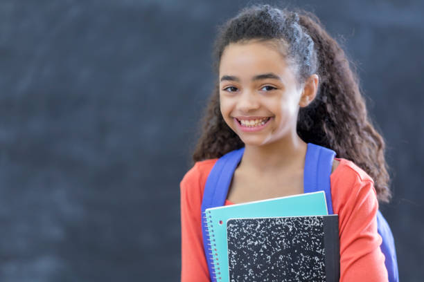 istock Cheerful preteen middle school student in classroom 648947262