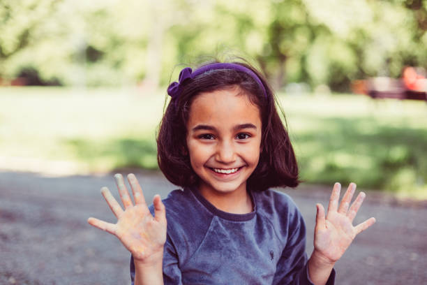 istock Little girl showing dirty hands 648949850